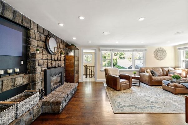 Fireplace, Interior, Living room, Recessed Lighting, Stone Walls, Wood Texture Flooring