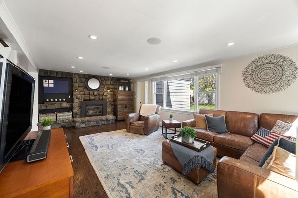 Fireplace, Interior, Living room, Recessed Lighting, Stone Walls, Wood Texture Flooring