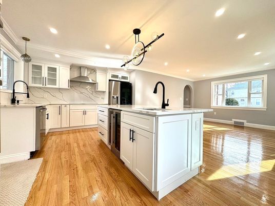 Interior, Kitchen, Marble Walls, Pendant Lights, Recessed Lighting, Stainless Steel Appliances, Wood Texture Flooring