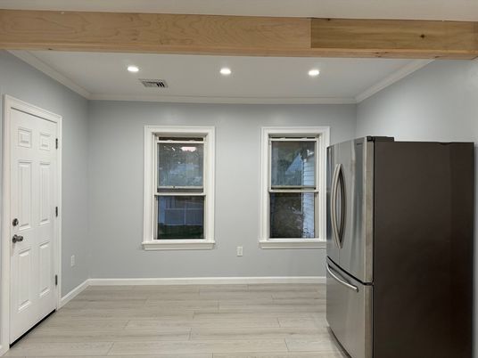Empty room, Interior, Kitchen, Recessed Lighting, Stainless Steel Appliances, Wooden Beams, Wood Texture Flooring