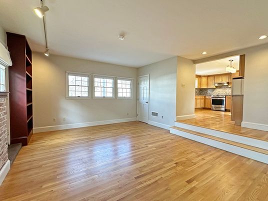 Empty room, Interior, Kitchen, Recessed Lighting, Stainless Steel Appliances, Wood Texture Flooring