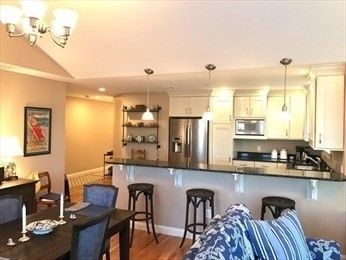 Chandelier, Dining room, Interior, Kitchen, Pendant Lights, Recessed Lighting, Stainless Steel Appliances, Wood Texture Flooring