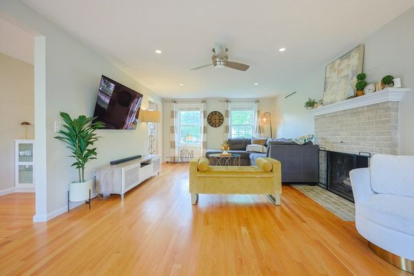 Fireplace, Interior, Living room, Recessed Lighting, Stone Walls, Wood Texture Flooring