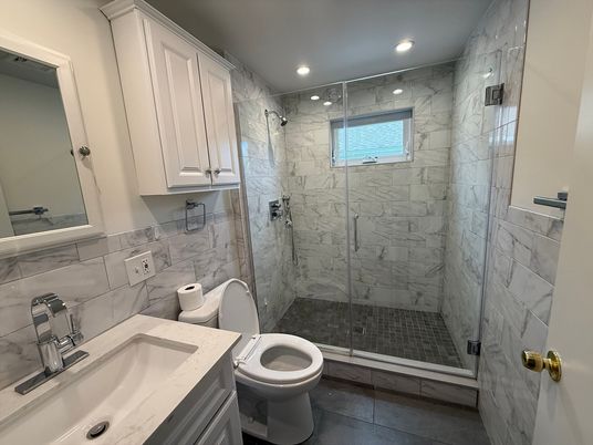 Bathroom, Dual Sink Vanities, Glass Shower, Interior, Marble Walls, Recessed Lighting