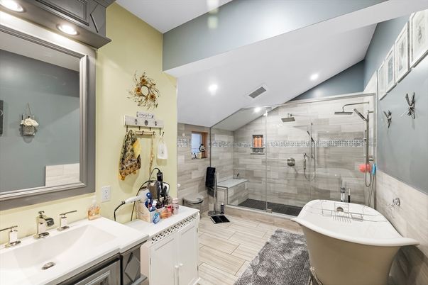 Bathroom, Dual Sink Vanities, Free Standing Baths, Glass Shower, Interior, Recessed Lighting, Wood Texture Flooring