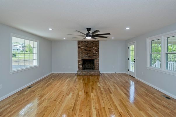 Empty room, Fireplace, Interior, Recessed Lighting, Stone Walls, Wood Texture Flooring