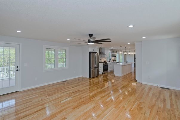 Empty room, Interior, Kitchen, Pendant Lights, Recessed Lighting, Stainless Steel Appliances, Wood Texture Flooring