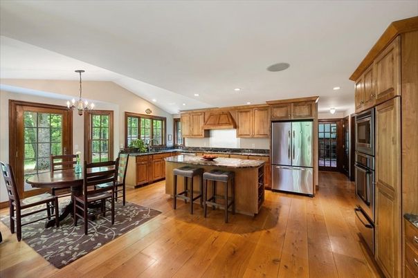 Chandelier, Dining room, Interior, Kitchen, Pendant Lights, Recessed Lighting, Stainless Steel Appliances, Wood Texture Flooring