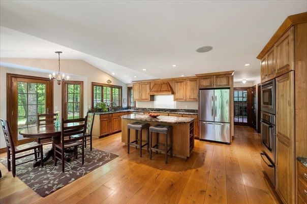 Chandelier, Dining room, Interior, Kitchen, Pendant Lights, Recessed Lighting, Stainless Steel Appliances, Wood Texture Flooring