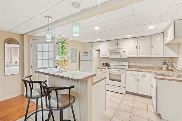 Interior, Kitchen, Pendant Lights, Recessed Lighting, Tile Countertops, Wood Texture Flooring