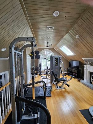 Fireplace, Fitness Equipment, Gym, Interior, Recessed Lighting, Wooden Ceilings, Wood Texture Flooring