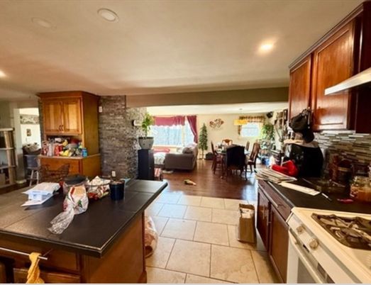 Dining room, Fireplace, Interior, Kitchen, Living room, Recessed Lighting, Stone Walls, Wood Texture Flooring