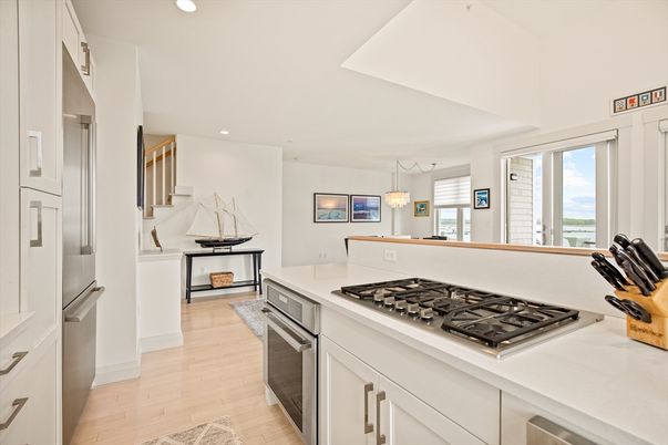 Chandelier, Interior, Kitchen, Pendant Lights, Recessed Lighting, Stainless Steel Appliances, Water, Wood Texture Flooring