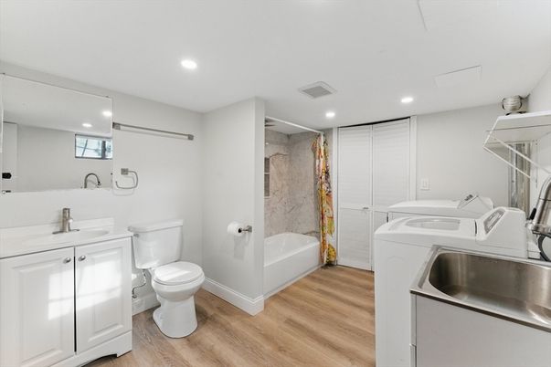 Bathroom, Interior, Recessed Lighting, Washer, Wood Texture Flooring