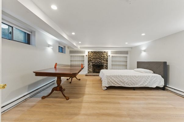 Bedroom, Fireplace, Interior, Recessed Lighting, Stone Walls, Wood Texture Flooring