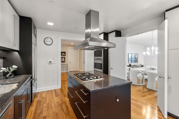 Chandelier, Dining room, Interior, Kitchen, Pendant Lights, Recessed Lighting, Stainless Steel Appliances, Wood Texture Flooring