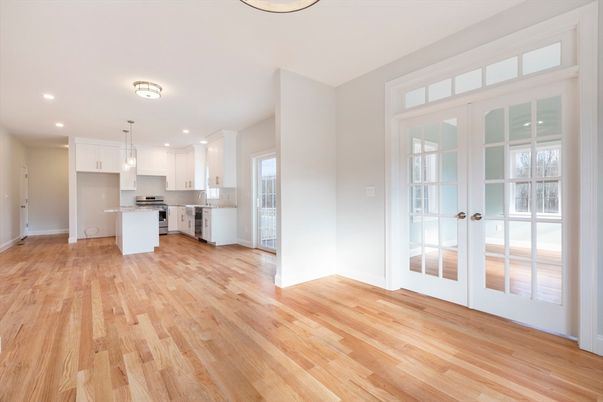 Empty room, Interior, Kitchen, Pendant Lights, Recessed Lighting, Stainless Steel Appliances, Wood Texture Flooring