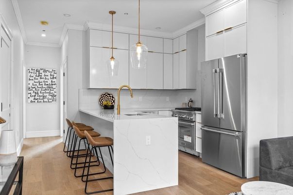 Interior, Kitchen, Marble Walls, Pendant Lights, Recessed Lighting, Stainless Steel Appliances, Wood Texture Flooring