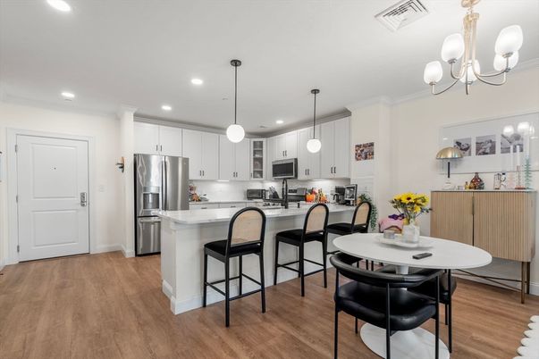 Dining room, Interior, Kitchen, Pendant Lights, Recessed Lighting, Stainless Steel Appliances, Wood Texture Flooring