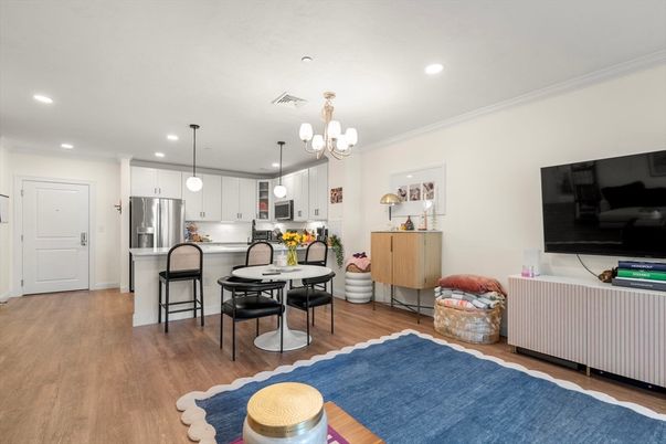 Chandelier, Dining room, Interior, Kitchen, Pendant Lights, Recessed Lighting, Stainless Steel Appliances, Wood Texture Flooring