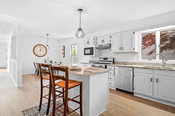 Dining room, Interior, Kitchen, Pendant Lights, Stainless Steel Appliances, Wood Texture Flooring