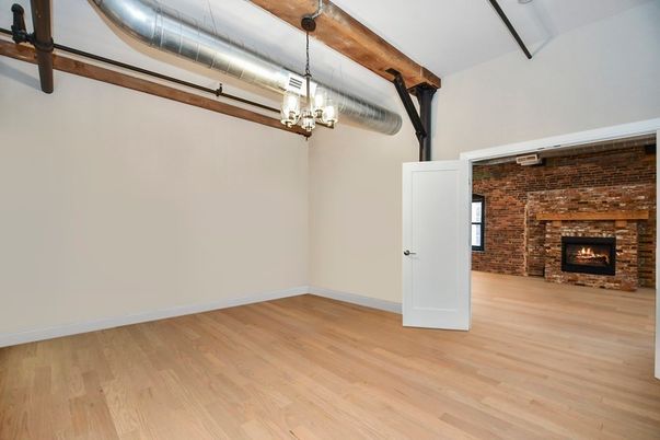 Empty room, Fireplace, Interior, Pendant Lights, Stone Walls, Wood Texture Flooring