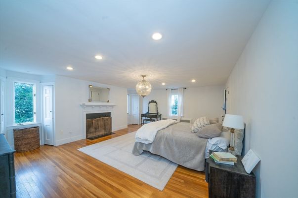 Bedroom, Chandelier, Fireplace, Interior, Recessed Lighting, Wood Texture Flooring