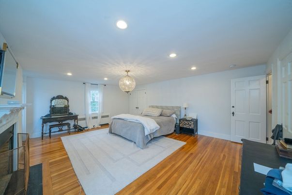 Bedroom, Chandelier, Fireplace, Interior, Piano, Recessed Lighting, Wood Texture Flooring