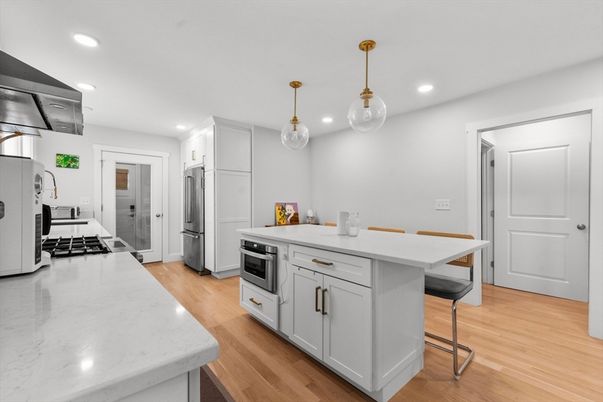 Interior, Kitchen, Pendant Lights, Recessed Lighting, Stainless Steel Appliances, Wood Texture Flooring
