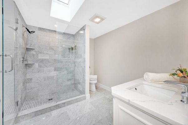 Bathroom, Dual Sink Vanities, Glass Shower, Interior, Marble, Marble Walls, Recessed Lighting