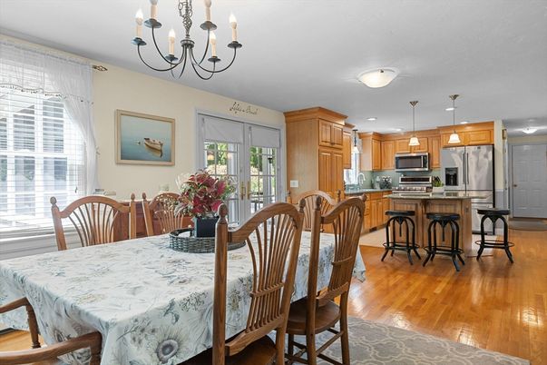 Chandelier, Dining room, Interior, Kitchen, Pendant Lights, Recessed Lighting, Stainless Steel Appliances, Wood Texture Flooring