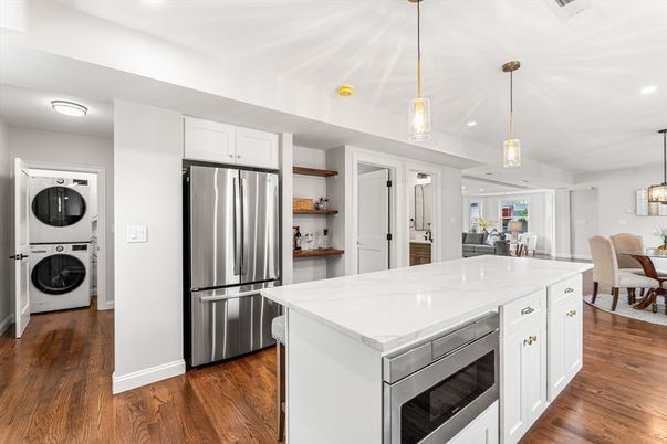 Dining room, Interior, Kitchen, Pendant Lights, Recessed Lighting, Stainless Steel Appliances, Washer, Wood Texture Flooring