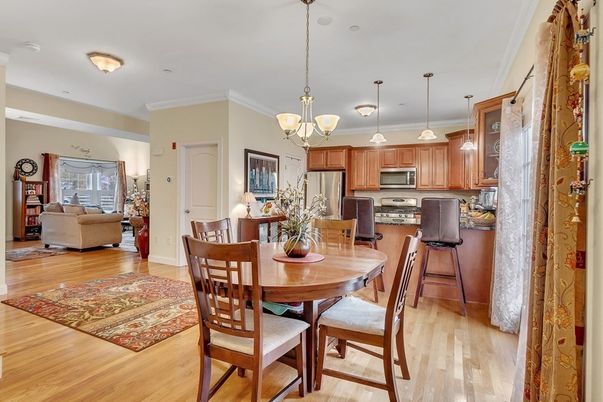 Chandelier, Dining room, Interior, Kitchen, Pendant Lights, Stainless Steel Appliances, Wood Texture Flooring