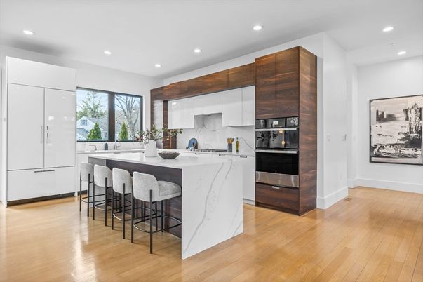 Interior, Kitchen, Marble Walls, Recessed Lighting, Stainless Steel Appliances, Wood Texture Flooring