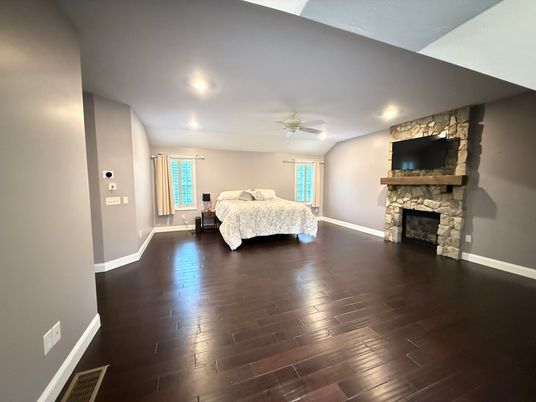 Bedroom, Fireplace, Interior, Recessed Lighting, Stone Walls, Wood Texture Flooring