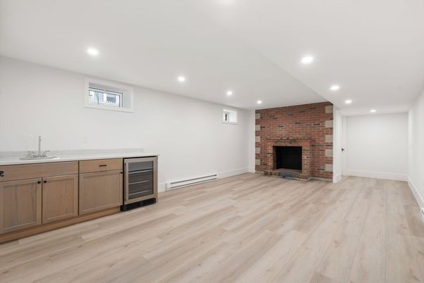 Empty room, Fireplace, Interior, Recessed Lighting, Stone Walls, Wood Texture Flooring