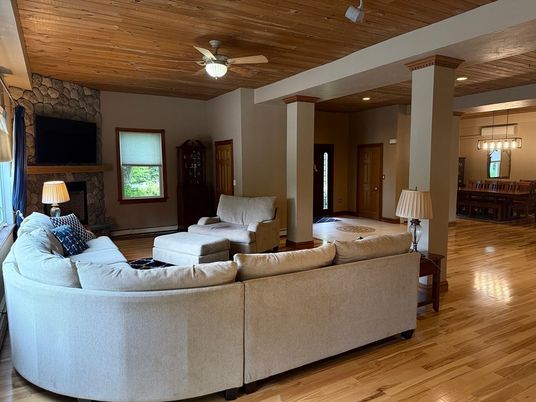 Dining room, Fireplace, Interior, Living room, Pendant Lights, Recessed Lighting, Stone Walls, Wooden Ceilings, Wood Texture Flooring