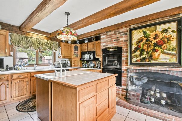 Fireplace, Interior, Kitchen, Pendant Lights, Stone Walls, Tile Countertops, Wooden Beams
