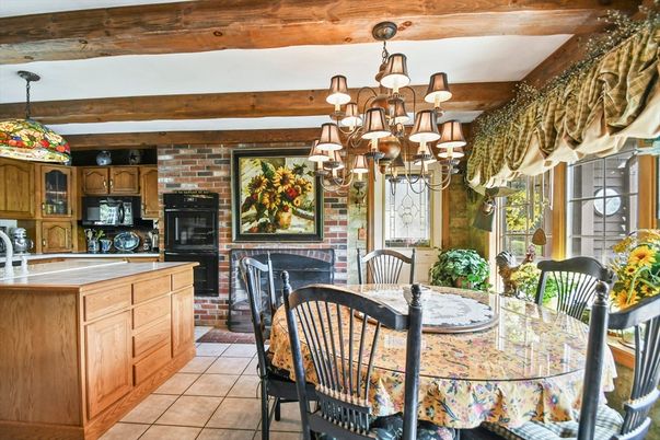 Chandelier, Dining room, Fireplace, Interior, Kitchen, Pendant Lights, Stone Walls, Wooden Beams