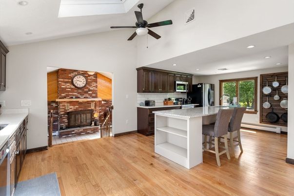 Fireplace, Interior, Kitchen, Recessed Lighting, Stone Walls, Wood Texture Flooring
