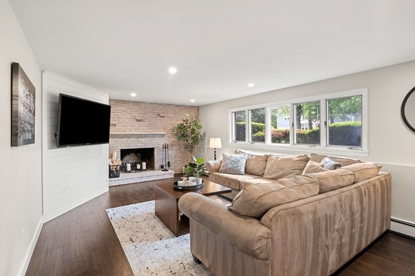 Fireplace, Interior, Living room, Recessed Lighting, Stone Walls, Wood Texture Flooring