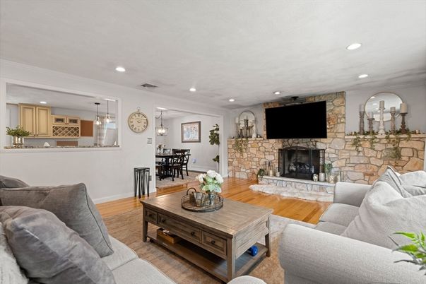 Dining room, Fireplace, Interior, Living room, Pendant Lights, Recessed Lighting, Stone Walls, Wood Texture Flooring