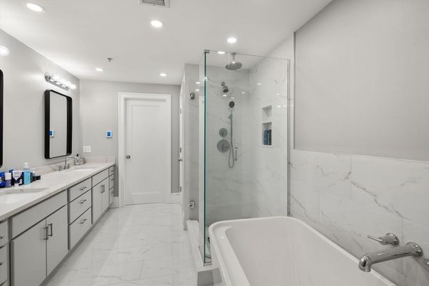 Bathroom, Dual Sink Vanities, Glass Shower, Interior, Marble, Marble Walls, Recessed Lighting