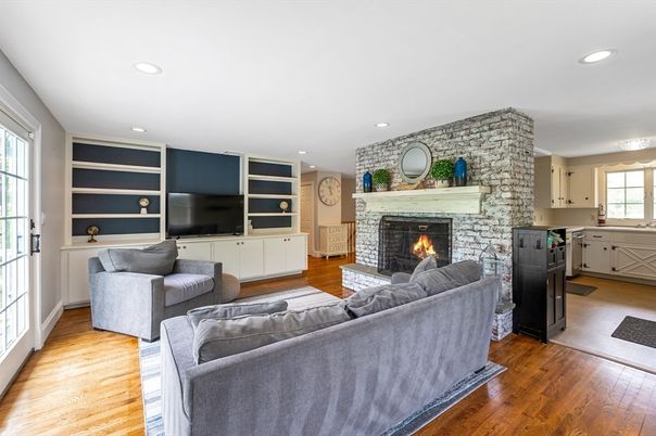 Fireplace, Interior, Living room, Recessed Lighting, Stone Walls, Wood Texture Flooring