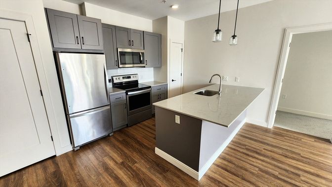 Interior, Kitchen, Pendant Lights, Recessed Lighting, Stainless Steel Appliances, Wood Texture Flooring