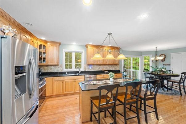 Chandelier, Dining room, Interior, Kitchen, Pendant Lights, Recessed Lighting, Stainless Steel Appliances, Wood Texture Flooring