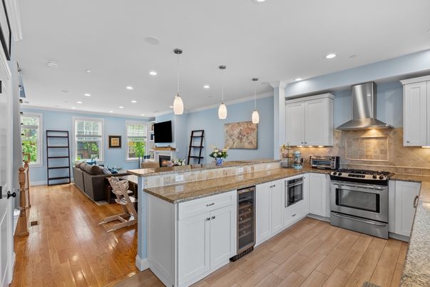 Fireplace, Interior, Kitchen, Living room, Pendant Lights, Recessed Lighting, Stainless Steel Appliances, Wood Texture Flooring