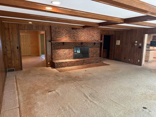 Empty room, Fireplace, Interior, Recessed Lighting, Stone Walls, Wooden Beams, Wooden Walls