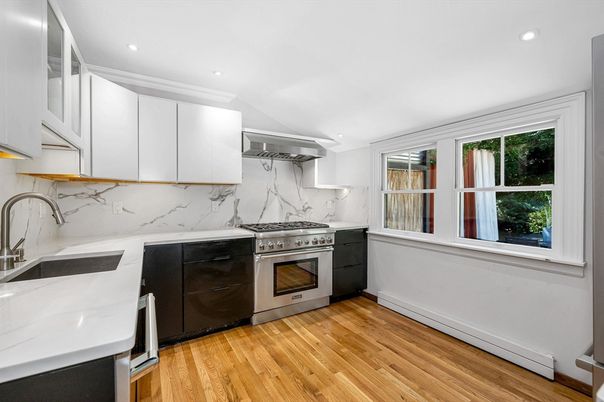 Interior, Kitchen, Marble Walls, Recessed Lighting, Stainless Steel Appliances, Wood Texture Flooring