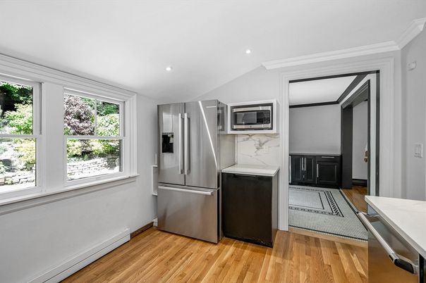 Interior, Kitchen, Marble Walls, Recessed Lighting, Stainless Steel Appliances, Wood Texture Flooring